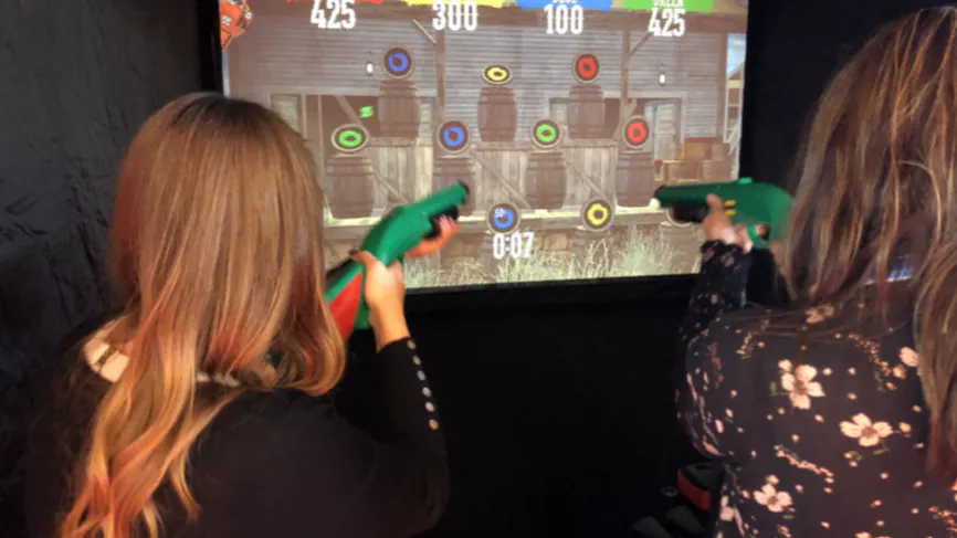 Players at the Wild West shooting simulator